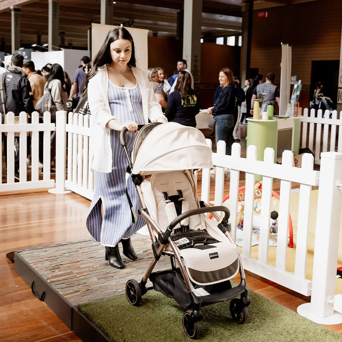  Pregnant mum testing a pram on the pram trial track at the Baby Expo in Sydney.