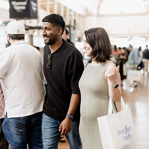 Happy couple at the Baby Expo in Sydney, discovering baby essentials—register for free tickets now!