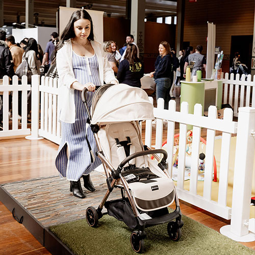 Expecting mum trying out a pram on the trial track at the Baby Expo in Sydney, testing for comfort and ease.