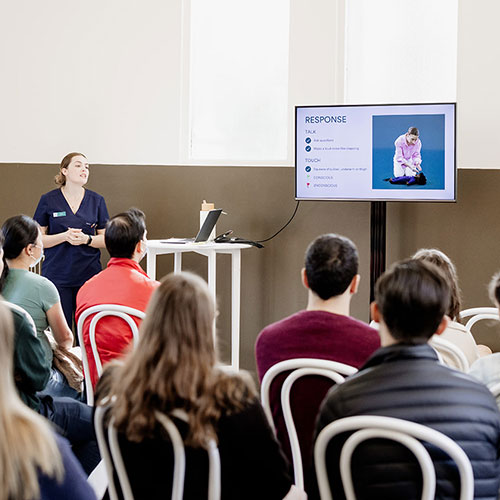 Expert leading a baby first aid session at the Baby Expo in Sydney, offering life-saving tips for new parents