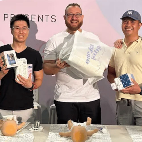 Dads ready to win prizes at the nappy changing competition in Melbourne baby expo